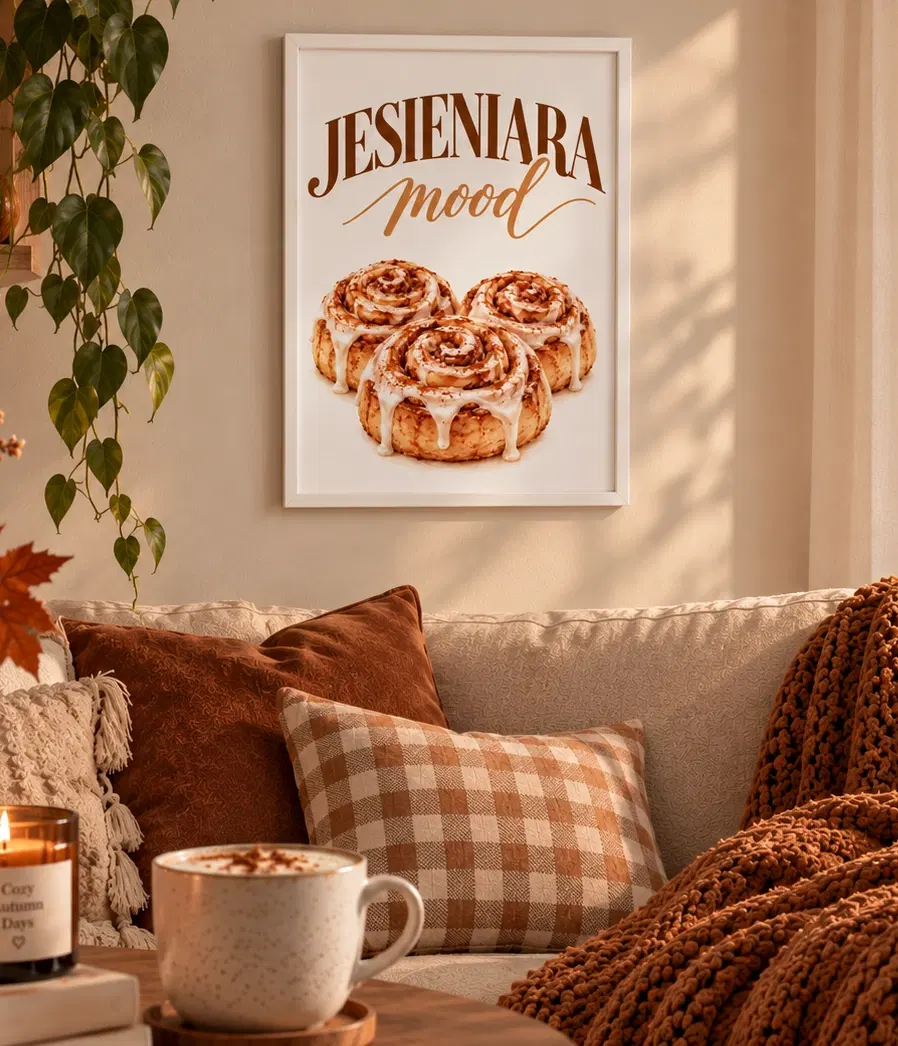 Plakat w ramce na tle kremowej ściany, ze świecą i stołem